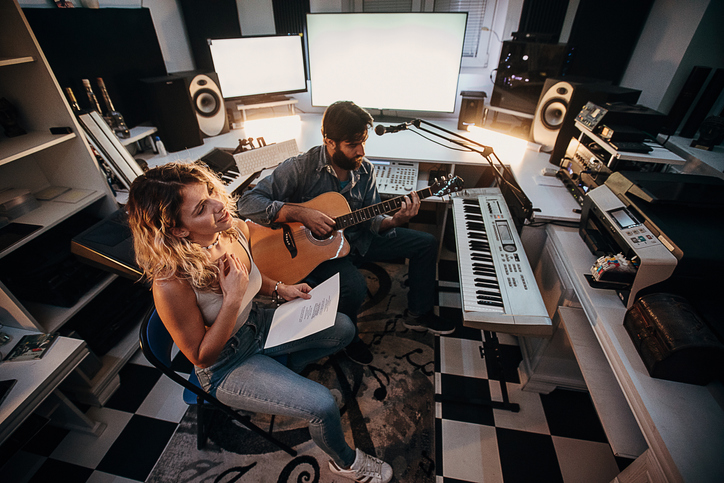 Two Young Musician Composing Music In The Studio